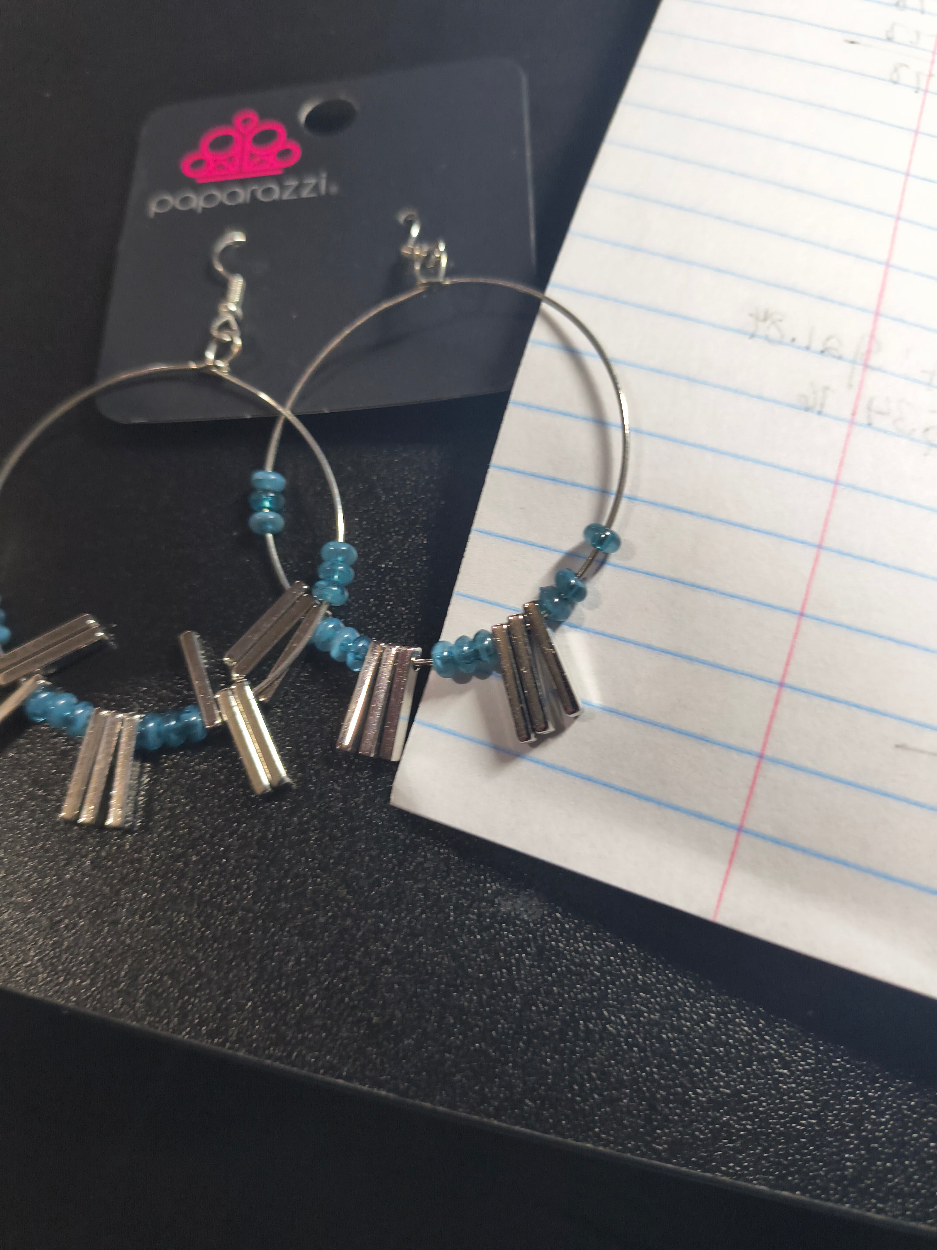 Blue earrings with silver dangles and it's on a hoop